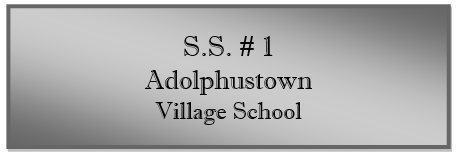 A grey sign with black text

Description automatically generated