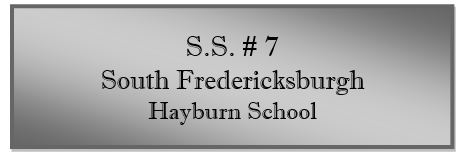 A grey rectangular sign with black text

Description automatically generated